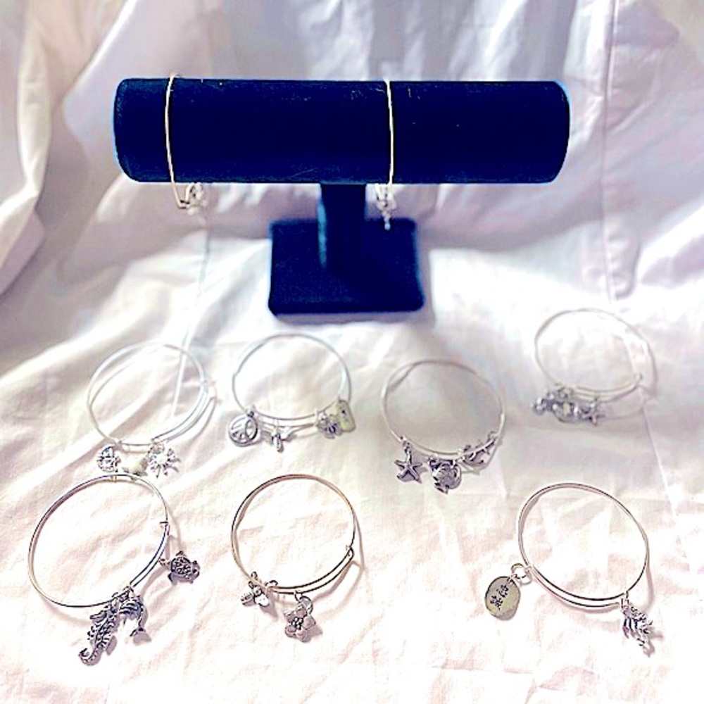 Homemade charm bracelets made with recycled material.